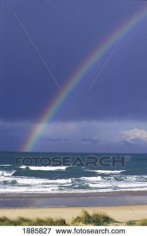 Rainbow Over Empty Beach View Large Photo Image Stock Photo - Rainbow Over Empty Beach. Fotosearch