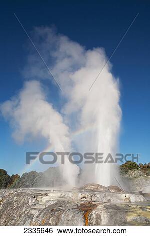 Stock Photograph - Rainbow Over Geyser; New Zealand. Fotosearch