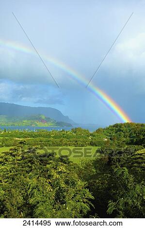 Stock Photography - Rainbow over hanalei bay; Kauai, Hawaii, United States of America. Fotosearch