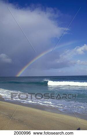 Rainbow Over Ocean Into Horizon View From Shoreline Clouds, Blue Sky View Large Photo Image Stock Photograph - Rainbow Over Ocean Into Horizon View From Shoreline Clouds, Blue Sky. Fotosearch
