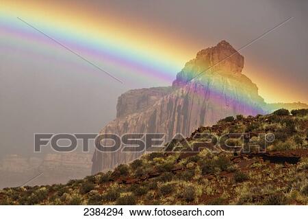 Picture - Rainbow over the Cliffs of Insanity; Indian Creek, Utah, United States of America. Fotosearch