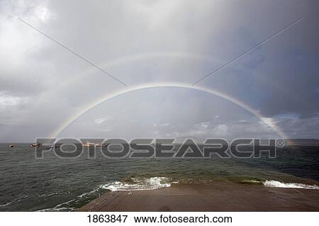 Rainbows Over Water, Island Of Iona, Scotland View Large Photo Image Stock Photo - Rainbows Over Water, Island Of Iona, Scotland. Fotosearch
