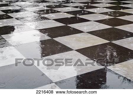 Stock Photo - Raindrops On A Marble Black And White Tile Floor, Delhi, Uttar Pradesh, India. Fotosearch