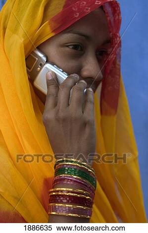Stock Photography - Rajasthani Woman On Mobile Phone. Fotosearch