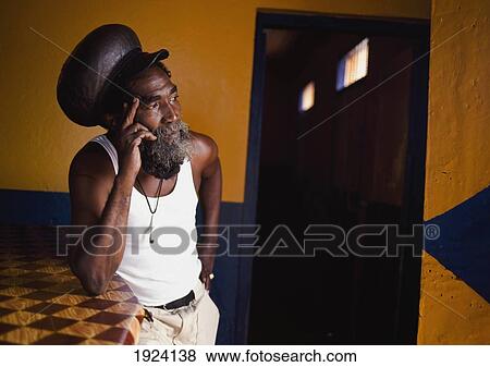Stock Photo - Rasta Leaning Against Bar. Fotosearch