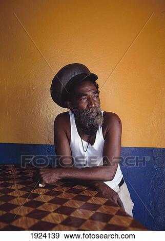 Stock Photo - Rasta Leaning Against Bar. Fotosearch