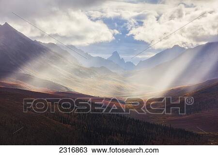 Rays Of Light Shine Over The Colors Of Autumn In Klondike Valley Of Tombstone Territorial Park; Yukon Canada View Large Photo Image Stock Image - Rays Of Light Shine Over The Colors Of Autumn In Klondike Valley Of Tombstone Territorial Park; Yukon Canada. Fotosearch