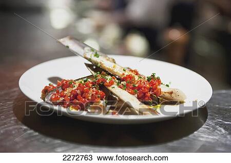 Stock Image - Razor clams on a plate in a restaurant; boston massachusetts usa. Fotosearch
