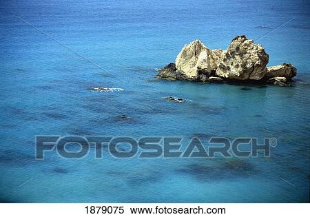 Stock Photography - Rcok Formation Standing Out Of Turquoise Water. Fotosearch