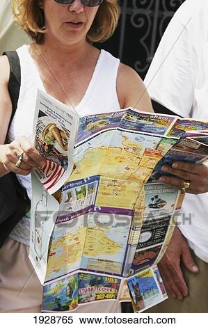 Stock Photography - Reading A Map. Fotosearch