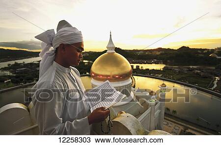 Reading from the tower of the Sultan Omar Ali Saifuddin mosque; Bandar Seri Begawan, Brunei View Large Photo Image Stock Image - Reading from the tower of the Sultan Omar Ali Saifuddin mosque; Bandar Seri Begawan, Brunei. Fotosearch