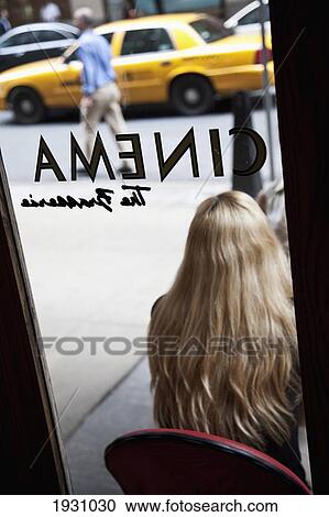 Rear View Of A Woman Sitting Outside Of Cinema Restaurant, New York City; New York City View Large Photo Image Stock Image - Rear View Of A Woman Sitting Outside Of Cinema Restaurant, New York City; New York City. Fotosearch