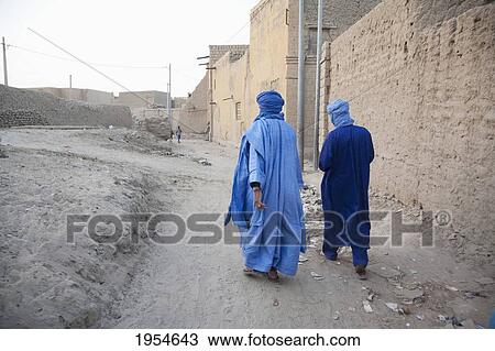 Rear view of two Tuareg men, Timbuktu, Mali View Large Photo Image Stock Image - Rear view of two Tuareg men, Timbuktu, Mali. Fotosearch