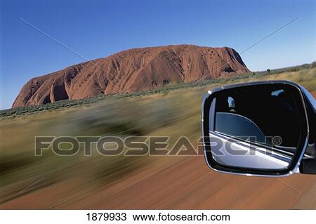 Stock Image - Rearview Mirror And Uluru. Fotosearch