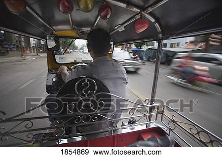 Stock Photo - Rearview Of Driver In Vehicle; Bangkok, Thailand. Fotosearch