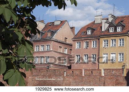 Rebuilt after the Second World War and now a UNESCO World Heritage Site, late-Renaissance style burgher houses built behind the Old Town defensive wall, Warsaw, Poland View Large Photo Image Stock Photography - Rebuilt after the Second World War and now a UNESCO World Heritage Site, late-Renaissance style burgher houses built behind the Old Town defensive wall, Warsaw, Poland. Fotosearch