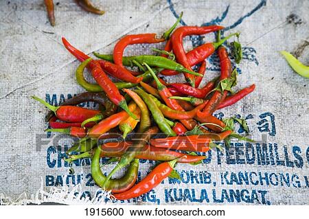 Stock Image - Red And Green Chilies For Sale. Fotosearch