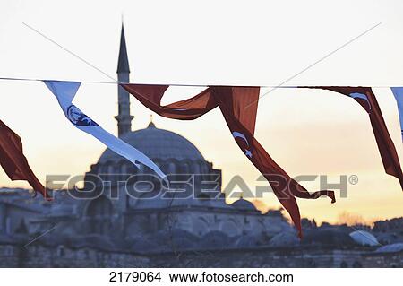 Red And White Fabric Flags Flying With The Rustem Pasha Mosque In The Background At Sunset; Istanbul Turkey View Large Photo Image Picture - Red And White Fabric Flags Flying With The Rustem Pasha Mosque In The Background At Sunset; Istanbul Turkey. Fotosearch