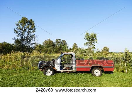 Red and white pickup truck with no engine hood in country field; Midland, Ontario, Canada View Large Photo Image Stock Photo - Red and white pickup truck with no engine hood in country field; Midland, Ontario, Canada. Fotosearch