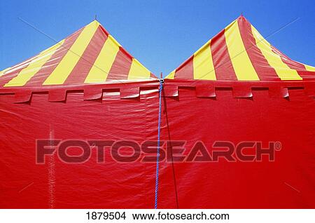 Picture - Red And Yellow Circus Tents On Blue Sky. Fotosearch