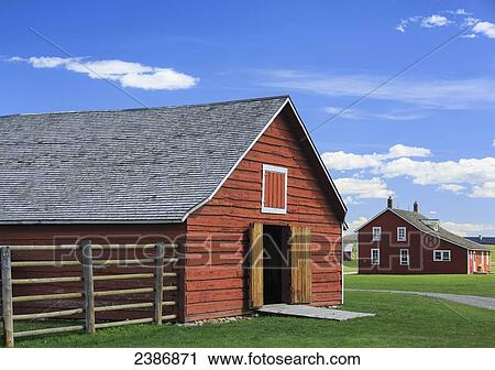 Stock Image - Red barn at Bar U Ranch, National Historic Site of Canada; Alberta, Canada. Fotosearch