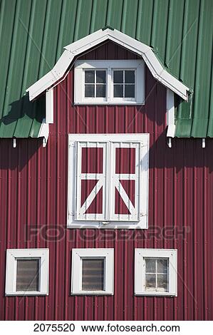 Stock Image - Red Barn With White Trim And Green Roof; Alberta Canada. Fotosearch