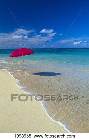 Red Beach Umbrella In Shoreline Waters, Clear Turquoise Water B1455 View Large Photo Image Stock Photo - Red Beach Umbrella In Shoreline Waters, Clear Turquoise Water B1455. Fotosearch
