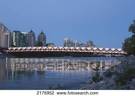 Red Bridge Over The Bow River At Twilight With Lights; Calgary Alberta Canada View Large Photo Image Stock Image - Red Bridge Over The Bow River At Twilight With Lights; Calgary Alberta Canada. Fotosearch