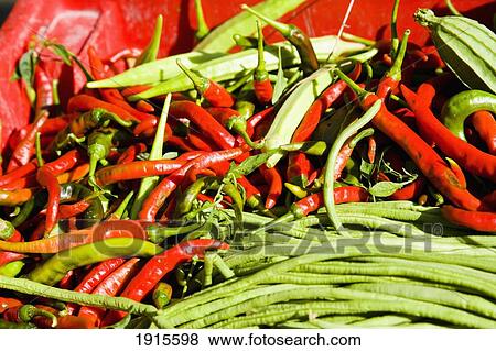Red Chilies And Green Vegetables View Large Photo Image Stock Photo - Red Chilies And Green Vegetables. Fotosearch