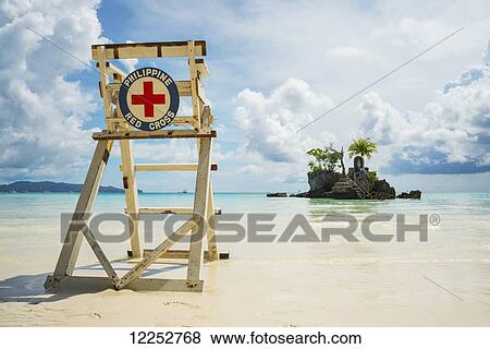 Stock Photo - Red cross lifeguarding chair on Boracay beach; Boracay, Panay, Philippines. Fotosearch