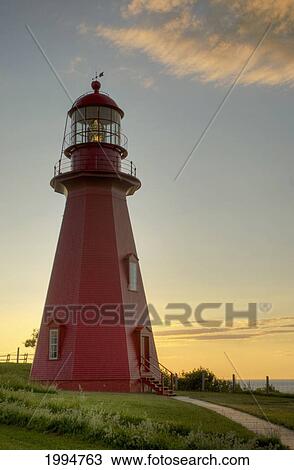 Red Lighthouse At Sunset; La Martre Quebec Canada View Large Photo Image Stock Image - Red Lighthouse At Sunset; La Martre Quebec Canada. Fotosearch