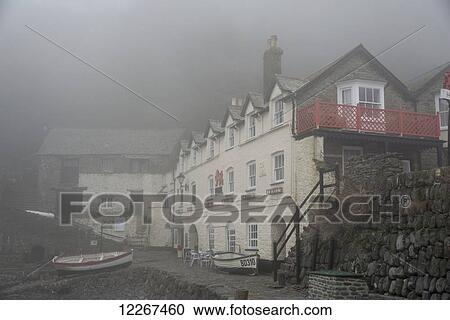 Red Lion Hotel on a foggy morning; Clovelly, Devon, England View Large Photo Image Stock Image - Red Lion Hotel on a foggy morning; Clovelly, Devon, England. Fotosearch