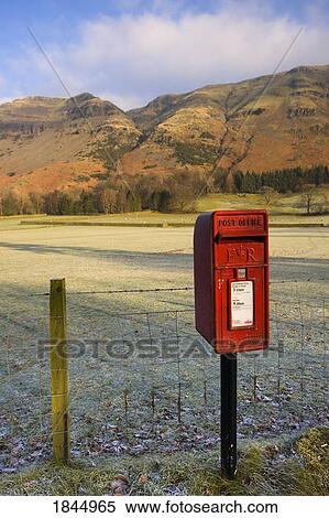 Stock Photography - Red Mailbox On Roadside, Fields In Background; Cumbria, England, Uk. Fotosearch