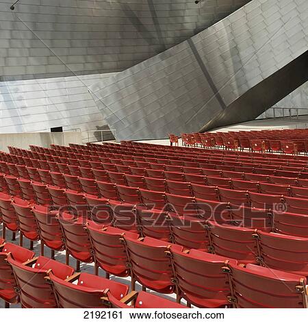Stock Image - Red Plastic Seating Inside A Building; Chicago Illinois United States Of America. Fotosearch