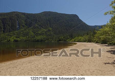 Red sand beach on Sager Lake in the Central Coast; British Columbia, Canada View Large Photo Image Stock Photo - Red sand beach on Sager Lake in the Central Coast; British Columbia, Canada. Fotosearch
