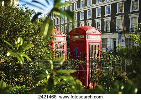 Stock Photo - Red telephone booths in Primrose Hill; London, England. Fotosearch