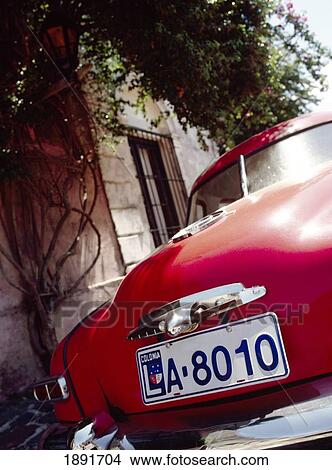 Picture - Red Vintage Car With Uruguay Number Plate. Fotosearch