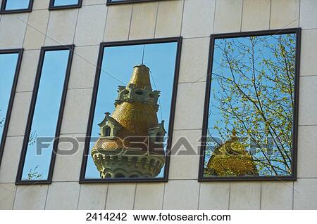 Reflection of a unique tower, tree and blue sky in a building window; Barcelona, Spain View Large Photo Image Stock Image - Reflection of a unique tower, tree and blue sky in a building window; Barcelona, Spain. Fotosearch