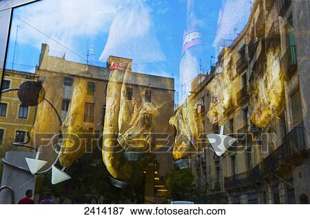 Reflection of buildings in a window with meat hanging for sale; Barcelona, Spain View Large Photo Image Stock Photo - Reflection of buildings in a window with meat hanging for sale; Barcelona, Spain. Fotosearch