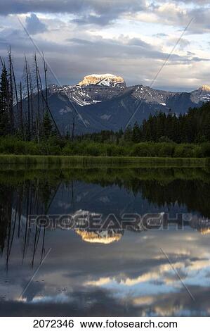 Stock Photograph - Reflection Of Mount Bourgeaux In Lake Vermillion, Banff National Park, Alberta, Canada. Fotosearch