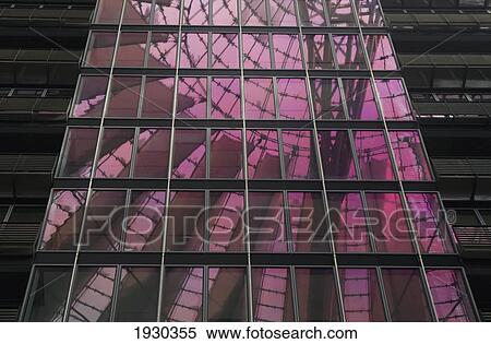 Stock Photography - Reflection of pink light and another building in windows; Berlin, Germany. Fotosearch