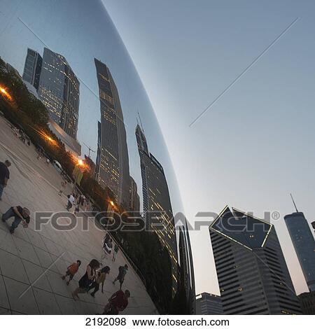 Stock Photo - Reflection Of Skyscrapers And Pedestrians In A Mirror Ball; Chicago Illinois United States Of America. Fotosearch