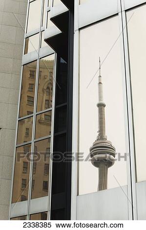 Stock Photography - Reflection Of The Cn Tower In A Gold Glass Building Window; Toronto, Ontario, Canada. Fotosearch