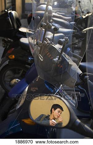 Reflection Of Woman Eating Ice Cream In Scooter Mirror View Large Photo Image Stock Image - Reflection Of Woman Eating Ice Cream In Scooter Mirror. Fotosearch