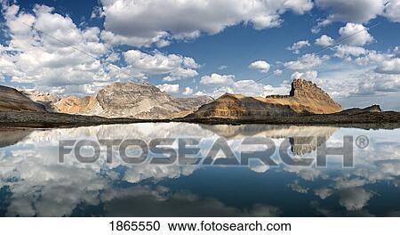Stock Image - Reflections In Lake, Cirque Peak, Banff National Park; Banff National Park, Alberta, Canada. Fotosearch
