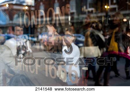 Reflections In The Ten Bells Window Glass Of Spitalfields Market And People, Spitalfields, East London, London, Uk View Large Photo Image Stock Photo - Reflections In The Ten Bells Window Glass Of Spitalfields Market And People, Spitalfields, East London, London, Uk. Fotosearch