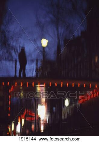 Picture - Reflections Of People On Bridge. Fotosearch