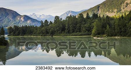 Reflections of trees in river; Pemberton, British Columbia, Canada View Large Photo Image Stock Image - Reflections of trees in river; Pemberton, British Columbia, Canada. Fotosearch