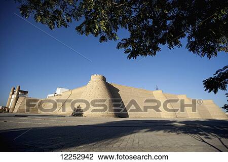 Registan square below the walls of the Ark Fortress, Old Town; Bukhara, Uzbekistan View Large Photo Image Stock Image - Registan square below the walls of the Ark Fortress, Old Town; Bukhara, Uzbekistan. Fotosearch