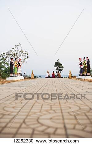 Relaxing atop the hilltop stupa; Luang Namtha, Laos View Large Photo Image Stock Image - Relaxing atop the hilltop stupa; Luang Namtha, Laos. Fotosearch